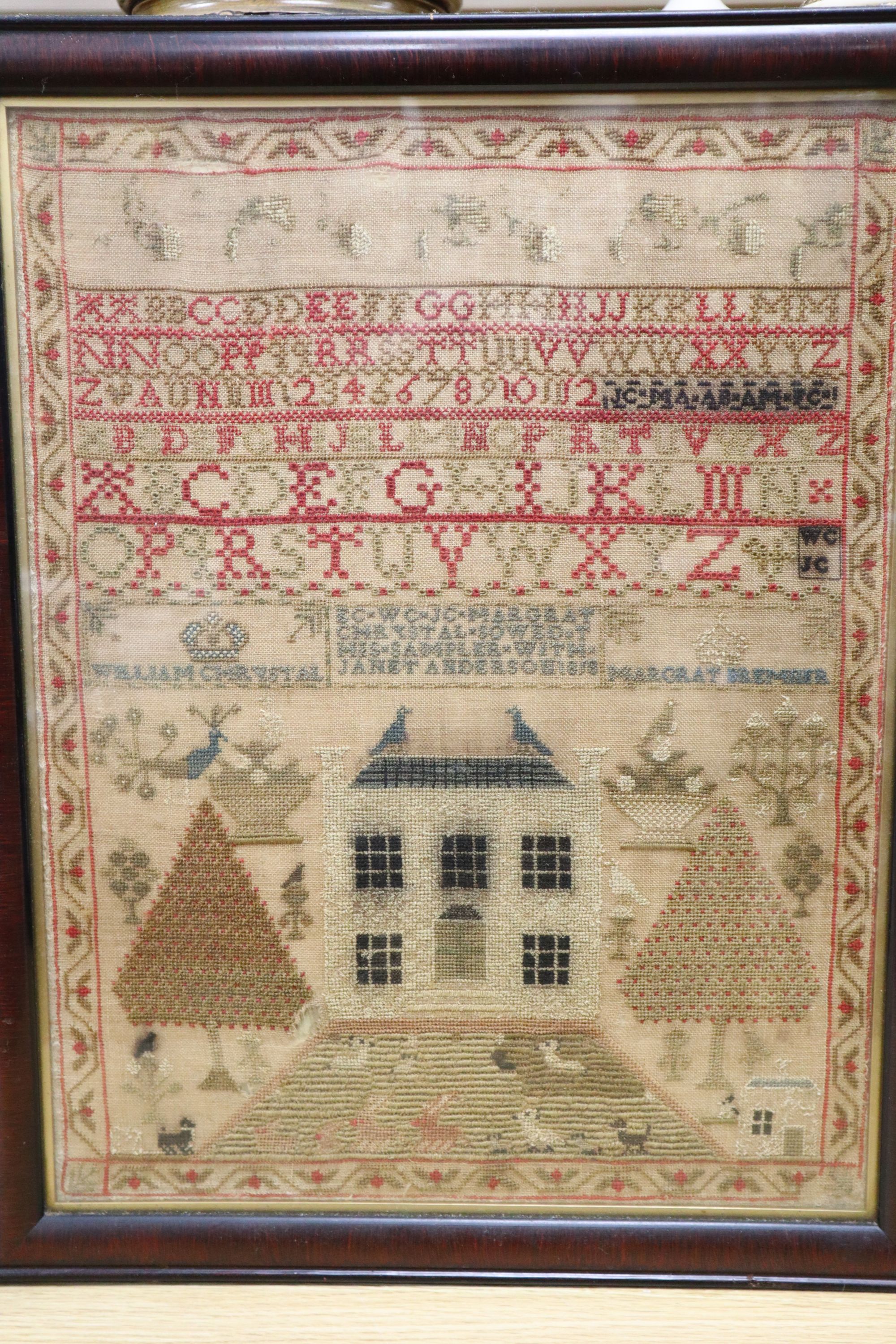 A framed George III sampler, dated 1818, 43 x 33cm, framed